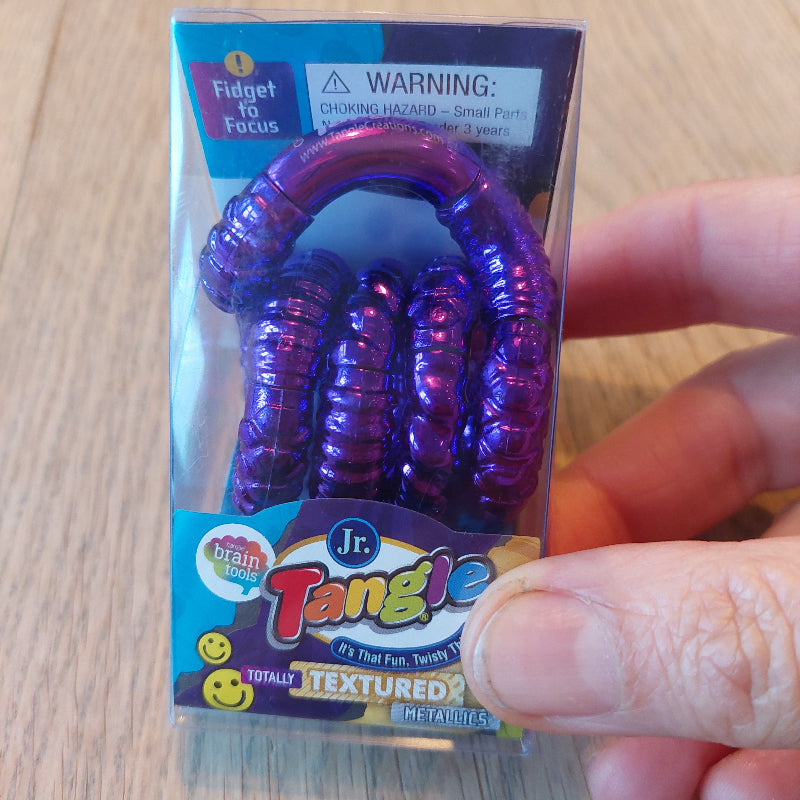 tangle structuur paars in verpakking, fidget tangle