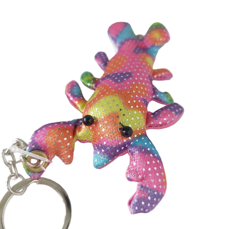Roze zanddier lobster sleutelhanger met voelbaar zand, compact sensorisch fidgetmateriaal voor fijne motoriek, concentratie en zelfregulatie, bevestigd aan sleutelring.