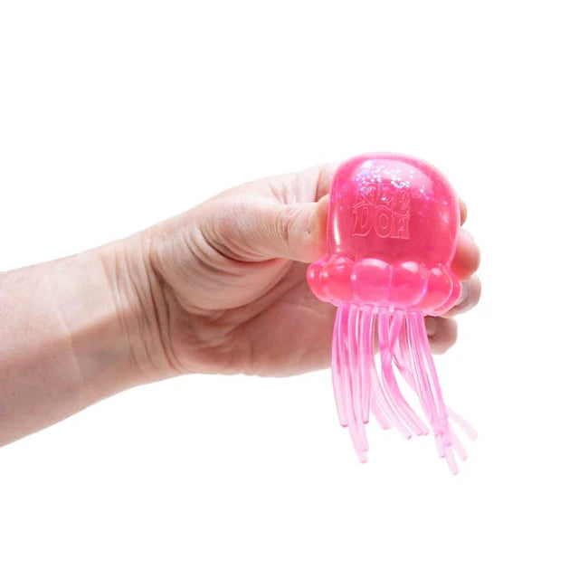 roze jelly squish in hand, antistressbal met sliertjes