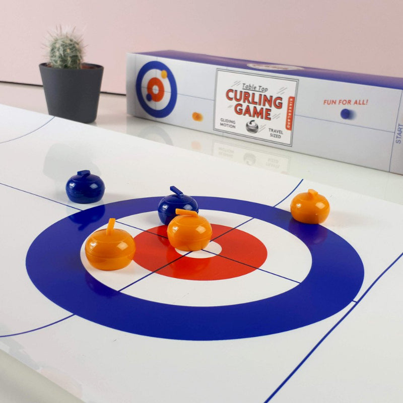 kikkerland Tafel curling, curling speelboard met verpakkingsdoos op de achtergrond