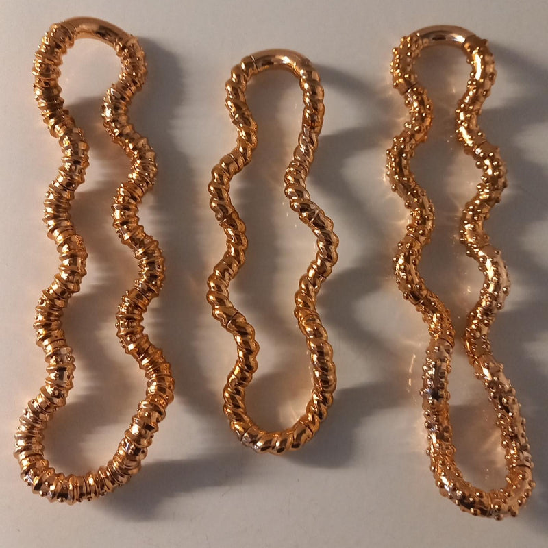 drie gouden structuur tangels gesorteerd op structuur, sensoriek fidget